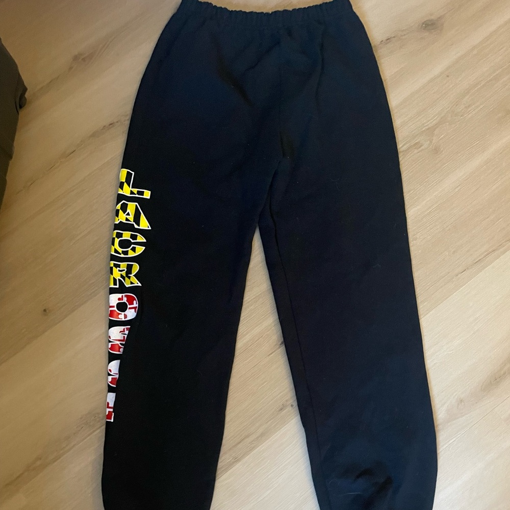 black sweatpants with a maryland logo